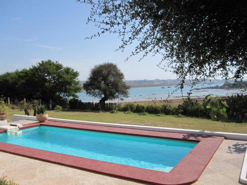a swimming pool with a view of the ocean at Villa Zahra in Larache