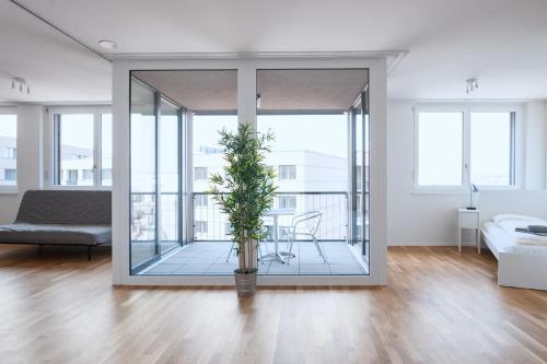 Area soggiorno di HITrental Basel Apartments