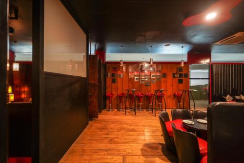 a dining room with chairs and tables in a restaurant at Triose Boutique Hotel Lonavala in Lonavala