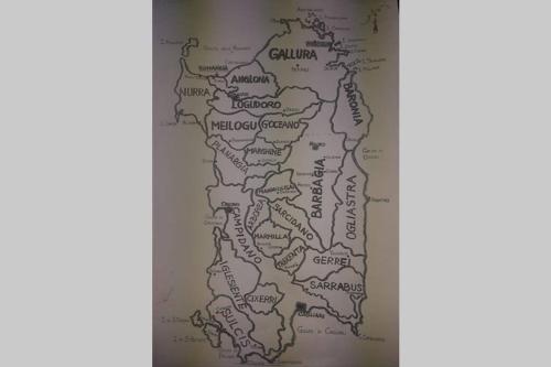 a map of bulgaria on a wall at Eco Lodge nella natura Con Piscina privata "La Grande Quercia" in Calangianus