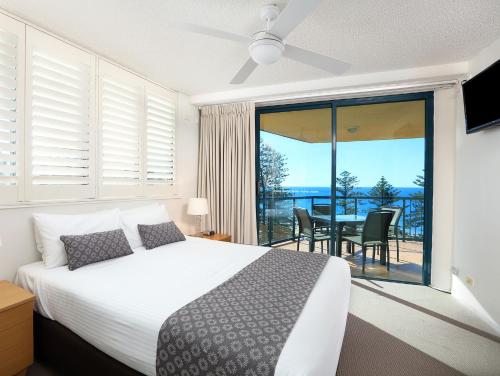 Postelja oz. postelje v sobi nastanitve Peninsular Beachfront Resort