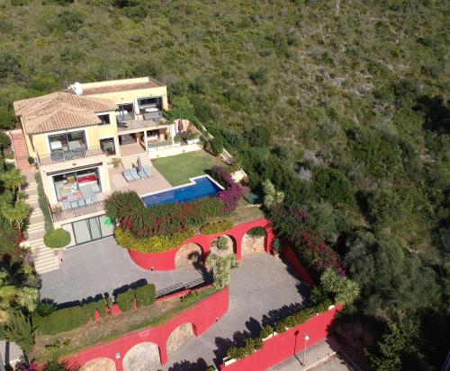 an overhead view of a house with a garden at Ca Na Bruixa,con piscina y vista al mar in Alcanada