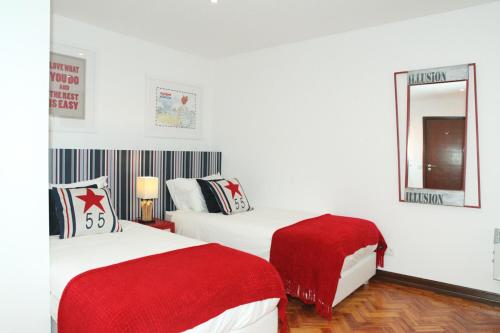 En eller flere senger på et rom på Fashionable and Modern Apartment - Cascais