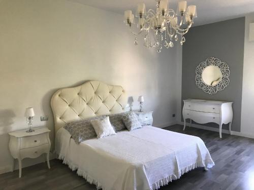 En eller flere senge i et værelse på APT ELENA FRONTE LAGO