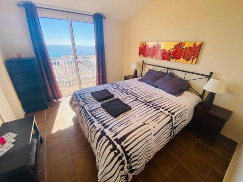 Posteľ alebo postele v izbe v ubytovaní The Feelgood House with jacuzzi and ocean view