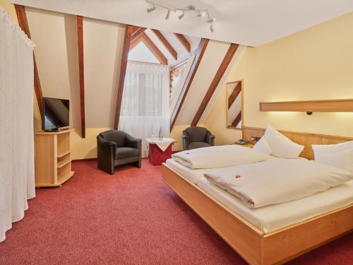 Postel nebo postele na pokoji v ubytování Hotel Garni Café Schacher