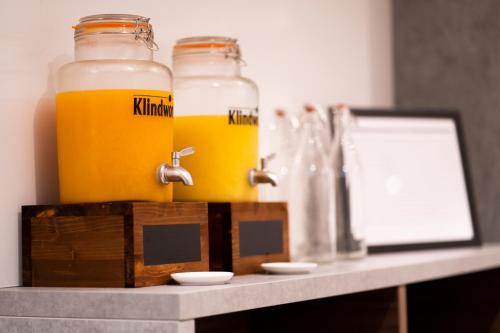 two bottles of beer sitting on a counter at Signature Hotel Skarv in Elmshorn