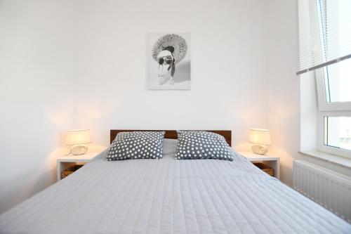 Posteľ alebo postele v izbe v ubytovaní Apartament Słoneczny przy Rybackiej
