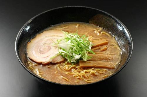 a bowl of soup with noodles and vegetables at STAY IN TOYOOKA in Asahikawa