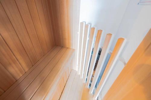 a row of wood panels in a room at STAY IN TOYOOKA in Asahikawa
