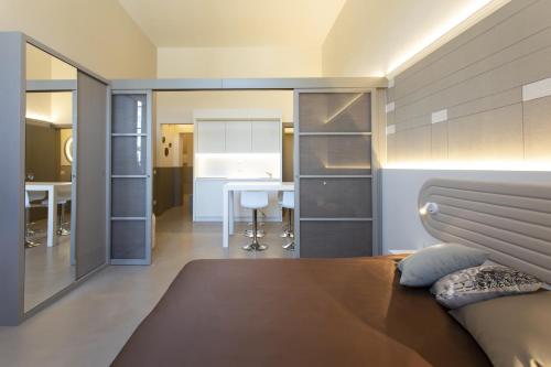a bedroom with a bed and a table in a room at Palazzo dei Ciompi Suites in Florence