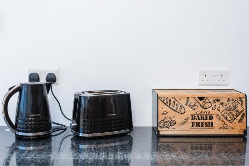 a toaster and a box on a counter at Dene Hollow Oroklini in Voroklini