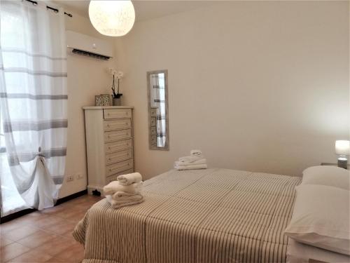 Ένα ή περισσότερα κρεβάτια σε δωμάτιο στο Amore Cove Apartment - Riomaggiore - 5 terre