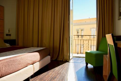 Postel nebo postele na pokoji v ubytování Hotel Cimarosa