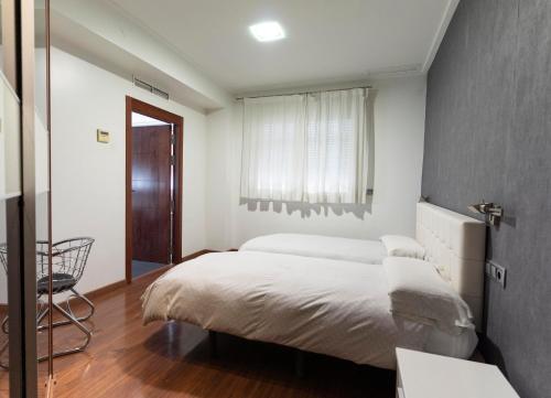 Postel nebo postele na pokoji v ubytování Hotel Lluna