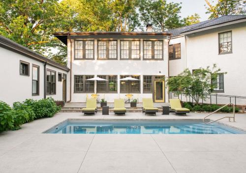 an exterior view of a house with a swimming pool at Oakhurst Inn at the University in Charlottesville