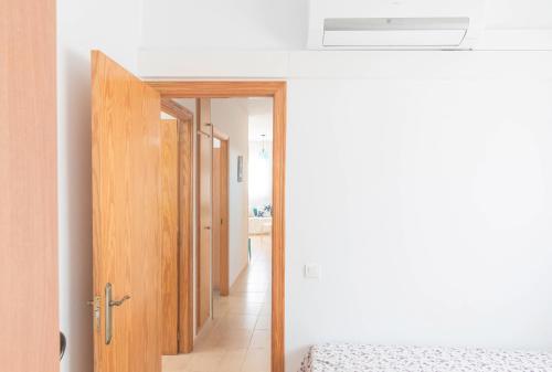 a bedroom with a door leading to a hallway at Villa Julia in Riumar