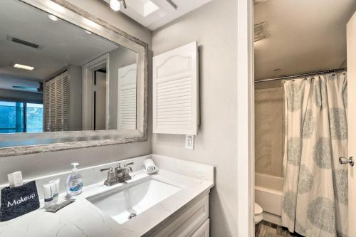 a bathroom with a sink and a mirror at Walk to Beach Resort-Style Siesta Key Condo! in Siesta Key