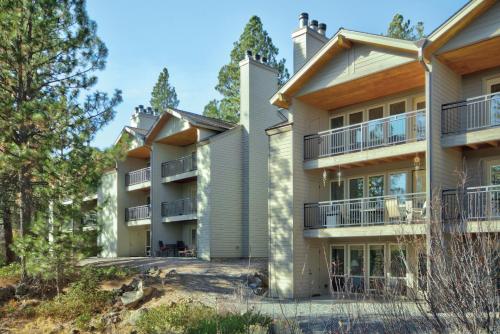 an exterior view of a building with trees at Seventh Mountain Resort in Bend
