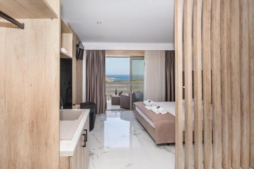 a bedroom with a bed and a sink and a tub at Xasteria in Elafonisi