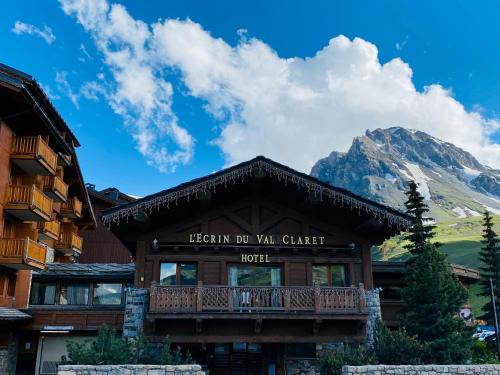 a resort building with a mountain in the background at Chalet Hotel L’Ecrin in Tignes