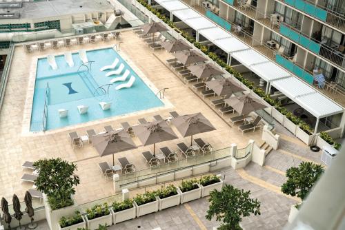 an aerial view of a building with a swimming pool at Waikiki Marina Resort at the Ilikai in Honolulu