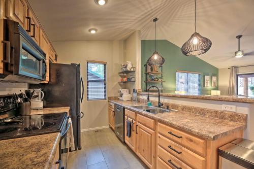 a kitchen with a sink and a stove at Trail Access Pet-Friendly Cabin in Show Low! in Show Low