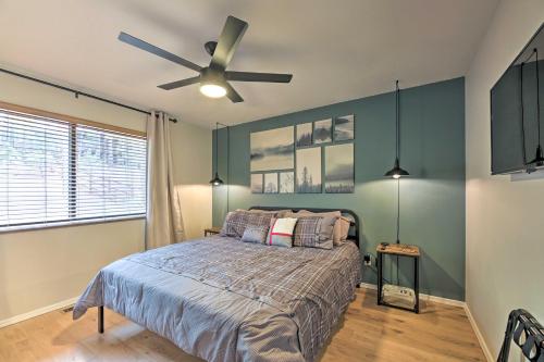 a bedroom with a bed and a ceiling fan at Trail Access Pet-Friendly Cabin in Show Low! in Show Low