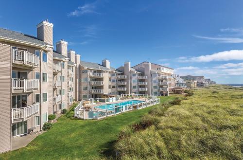 an aerial view of an apartment complex with a swimming pool at WorldMark Mariner Village in Ocean Shores