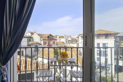 a balcony with a view of a city at Superb 3 stars flat w balcony - Saint-Jean-de-Luz - Welkeys in Saint-Jean-de-Luz