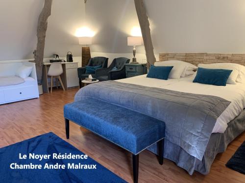 Postel nebo postele na pokoji v ubytování Le Noyer Résidence B&B