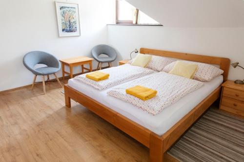 מיטה או מיטות בחדר ב-Apartmány Vista