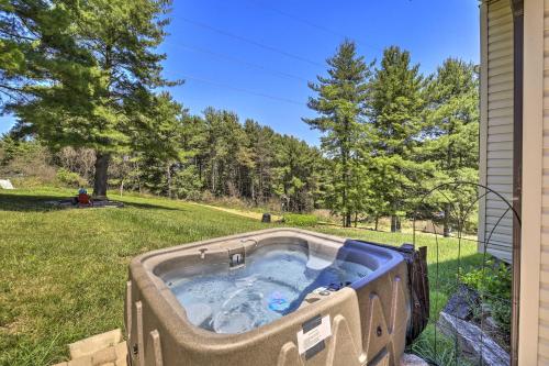 a hot tub in the yard of a house at Nature Escape in Wytheville with Covered Porch! in Wytheville