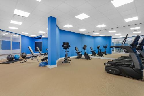 a gym with treadmills and elliptical machines at Holiday Inn Resort Kissimmee by the Parks by IHG in Orlando
