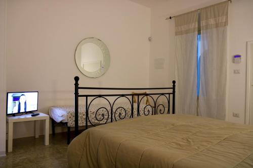 Gulta vai gultas numurā naktsmītnē Claudia Vacanze, Torre San Giovanni - Salento- climatizzato