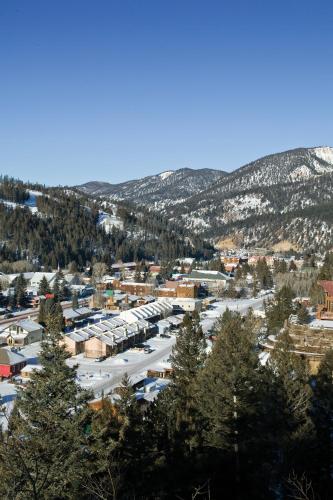an aerial view of a town with snow covered mountains at WorldMark Red River in Red River