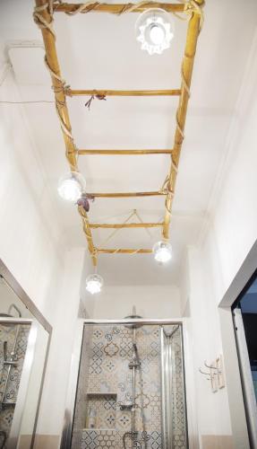 a ceiling in a bathroom with lights on it at La casetta sulle Stelle in Stella