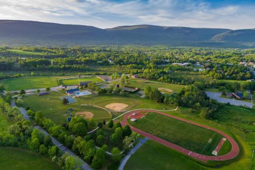 an aerial view of a park with mountains in the background at Aspen at Manchester in Manchester