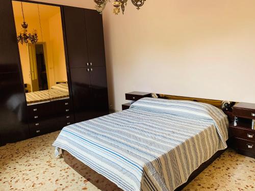 Postel nebo postele na pokoji v ubytování Li Vigni House