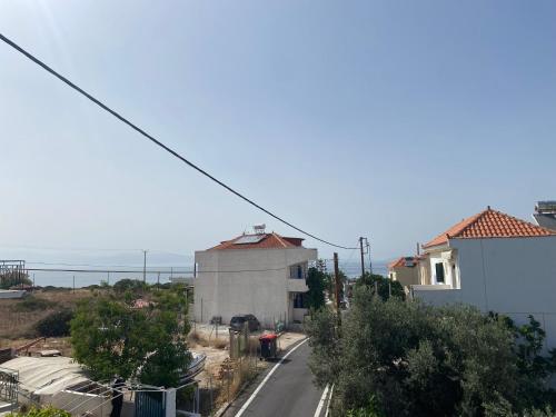 an empty street with a building in the distance at Studio Mare in Megalochori