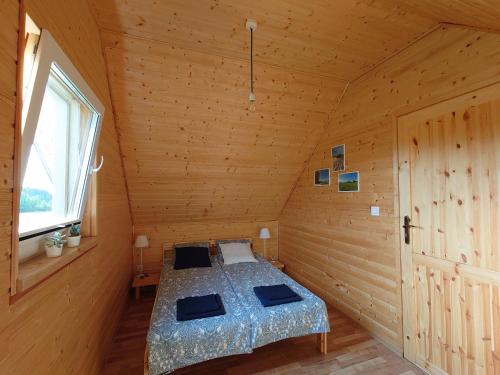 Postel nebo postele na pokoji v ubytování Domki Sielankowo