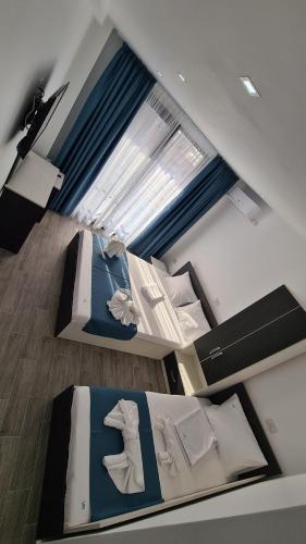 Postel nebo postele na pokoji v ubytování Vila Rares