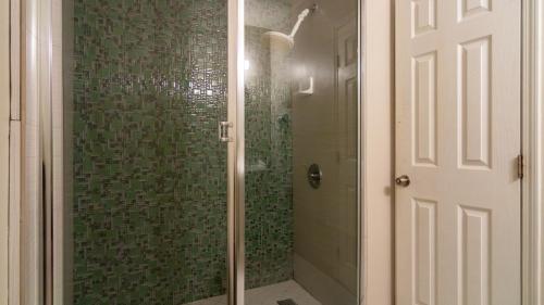a shower with a glass door in a bathroom at Americas Best Value Inn Rancho Palos Verdes in Rancho Palos Verdes