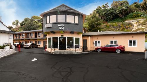 a building with a car parked in a parking lot at Americas Best Value Inn Rancho Palos Verdes in Rancho Palos Verdes