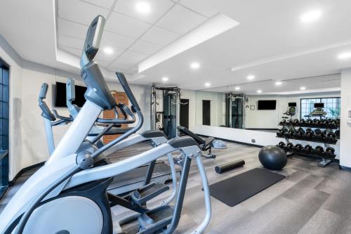 a gym with treadmills and exercise equipment in a building at Staybridge Suites Phoenix Glendale Sports Dist by IHG in Glendale