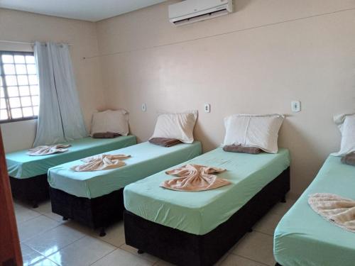 Giường trong phòng chung tại Hotel Por Do Sol