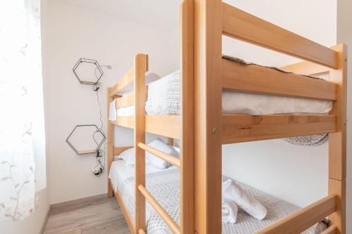 a bunk bed room with two bunk beds in a room at Villa Strikina kuca in Slivno