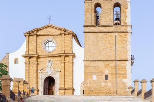 a church with a tower and a clock at BnB Sant'Alfonso in Agrigento