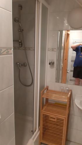 a bathroom with a shower and a sink at Penzión pri studničke Omastiná in Omastiná