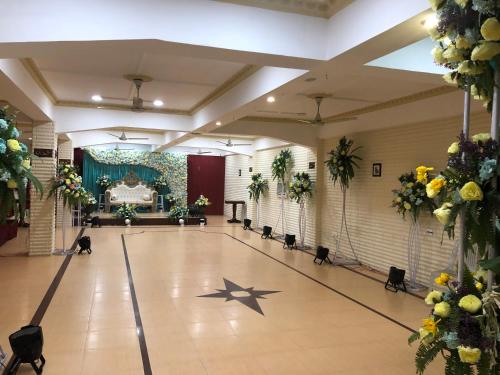 a dance floor in a hall with stars on the floor at Hotel Saluja in Siliguri